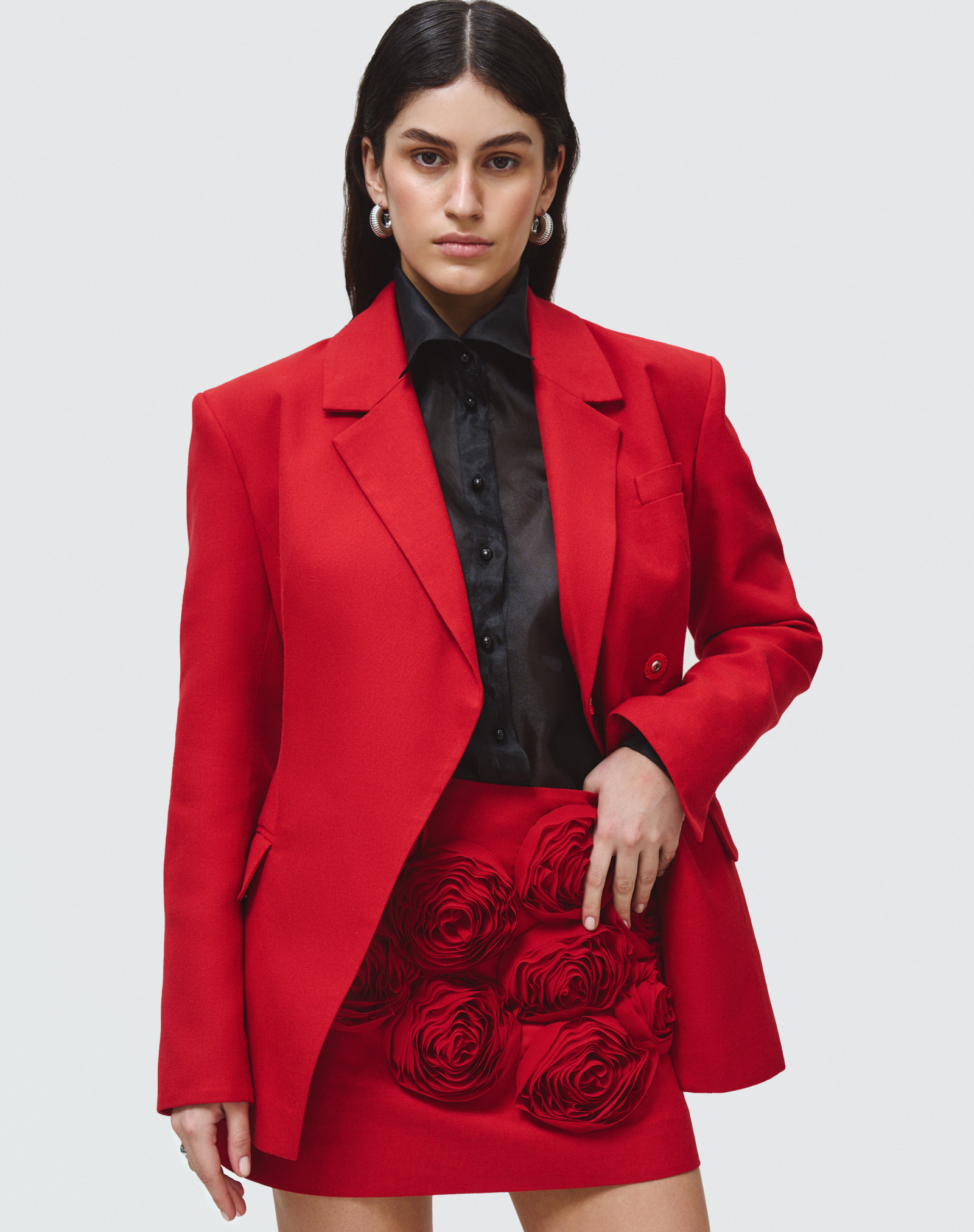 Red asymmetrical jacket with wide shoulders
